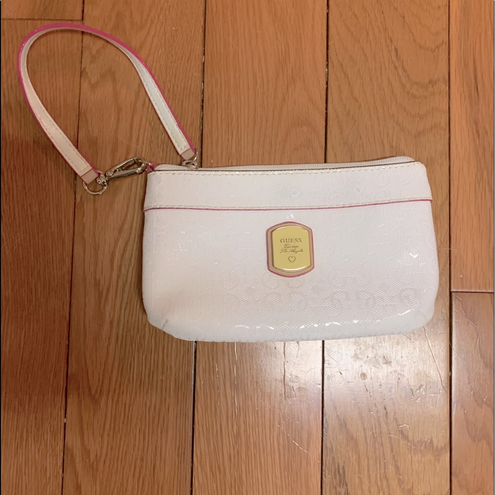 White pleather Guess wristlet with pink trim